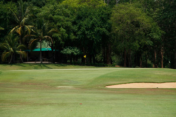 Obraz premium The evening golf course has sunlight shining down at golf course in Thailand