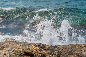 Waves breaking on a stony beach in Murter, Croatia, Dalmatia