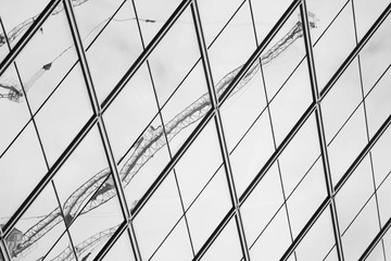 crain reflection on modern office window - monochrome