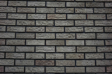 white wall of bricks with a gray tint brick background