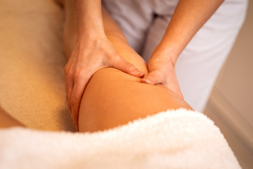 Fototapeta na wymiar Anti cellulite massage for young woman in beauty salon