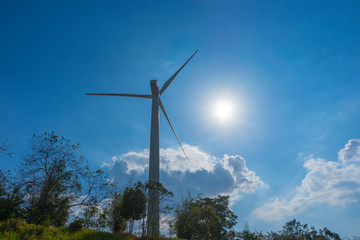 Fototapeta na wymiar wind turbine against blue sky.