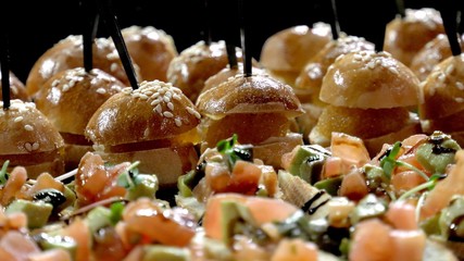 Mini canape with cheese meat and seafood close-up shot.