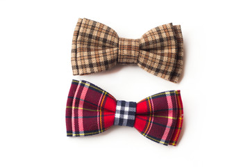 Brown checkered bow tie on a white background. Men's and women's accessories. Hipster style