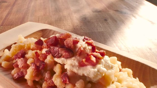 Potato dumplings with sheep cheese and bacon.