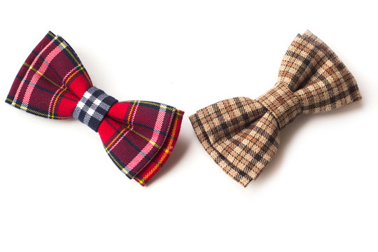 Brown checkered bow tie on a white background. Men's and women's accessories. Hipster style