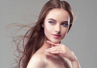 Beautiful brunette woman with long smooth hair beauty hairstyle female portrait