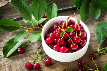 Berry Cherry on a wooden table rustic. Natural detox, fruit dessert, healthy dieting concept.