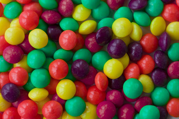 Background made of colorful dragee. A lot of round candies.