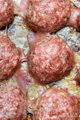 Meat cutlets cooked on a baking sheet in the oven