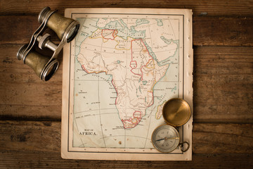 Binoculars and Compass on 1870 Map of Africa – World Travel