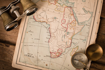 Binoculars and Compass on 1870 Map of Africa – World Travel