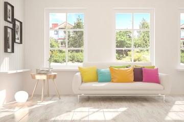 Stylish room in white color with sofa and summer landscape in window. Scandinavian interior design. 3D illustration