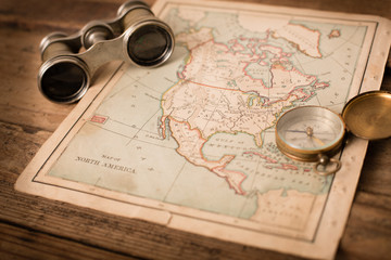 Binoculars and Compass on 1870 Map of North America – World Travel