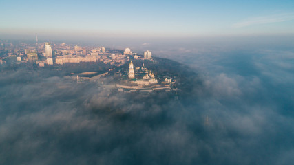 Aerial view of the right bank of Kiev covered with thick fog