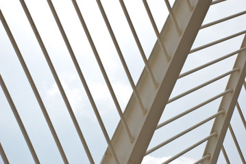 Sky through metal white construction. Modern urban geometric background.