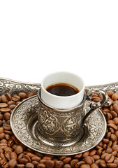Coffee cup and roasted coffee beans isolated on a white background. Free space for text.