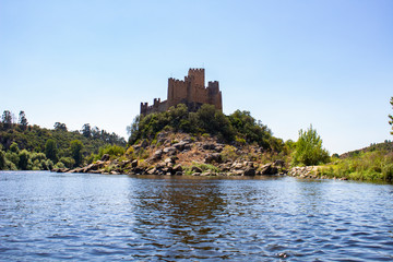 Fototapeta na wymiar THE RUINS OF A MEDIEVAL CASTLE ALMOUROL ON THE ISLAND IN THE MIDDLE OF RIVER TAGUS (TAJO, TEJO), PORTUGAL 