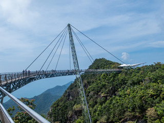 "A close up on a Langkawi Sky Bridge located 660 metres above sea level at the peak of Gunung Mat Cincang on Pulau Langkawi. Bridge is bent in an arch, making it a nice walk across it, sky walking. "