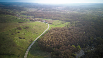 road for cars aerial view from top around green nature