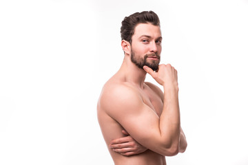Fototapeta premium Side view portrait of a young man with nude torso over white background