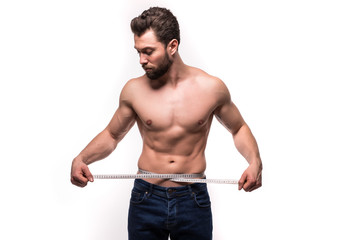 Young man use measurement tape for his torso isolated on white background