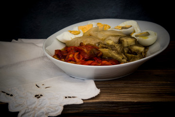 roasted red peppers, sweet onions, aubergines and boiled eggs on wooden background