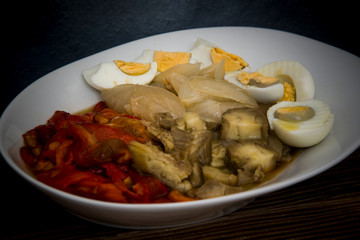 roasted red peppers, sweet onions, aubergines and boiled eggs on wooden background