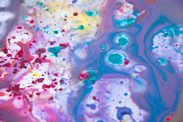 Fluid art  purple drops blue color background. Liquid acrylic paint backdrop decorative.