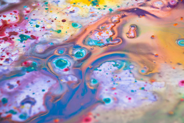 Fluid art  purple drops blue color background. Liquid acrylic paint backdrop decorative.