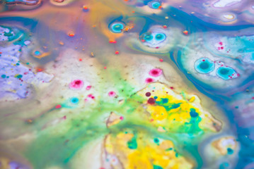 Fluid art  purple drops blue color background. Liquid acrylic paint backdrop decorative.