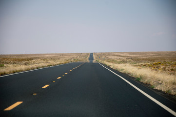 Dark straight highway in desert USA