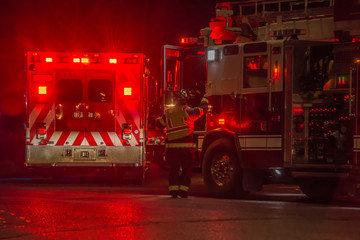 fire truck, firefighter, ambulance responding to car crash at night - Powered by Adobe