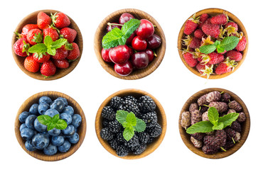 Collage of different fruits and berries. Raspberries, strawberries, cherries, mulberries, blueberries, blackberries with mint leaves on white background. Top view. Various fresh summer on white 