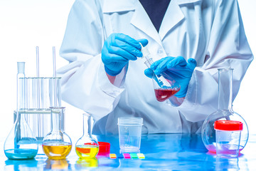 Chemical testing center. Chemist takes a sample of reagents. Chemical examination. Determination of the chemical composition of solutions. Laboratory test. Scientific research. Medicine.