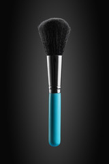 Fluffy, wide and soft powder brush new clean with blue handle promotional photo.