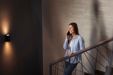 Fototapeta premium Woman speaking on the phone