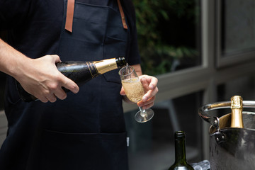 waiter serving champagne
