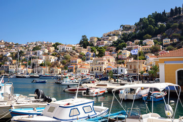 Beautiful Harbor and colorful buildings of the coastline of the island of Simi.