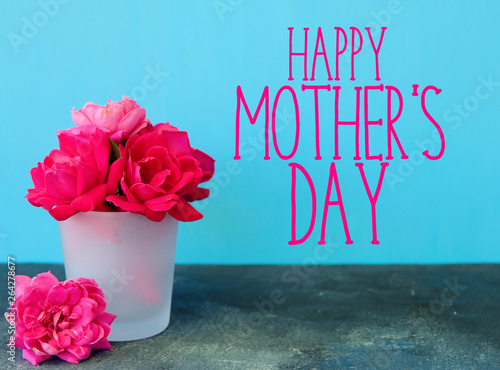 Happy Mother's Day banner with pink rose arrangement on bright blue background for holiday greeting.