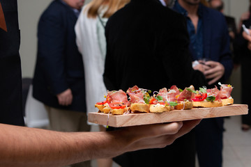 waiter carrying finger food