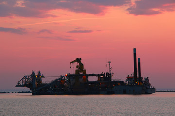 Ship silhouette and sunset sky