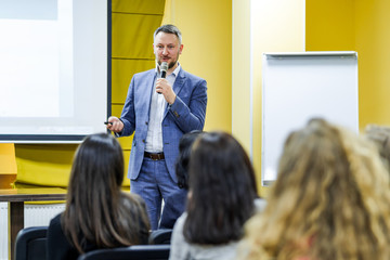 the speaker tells the speech at conference