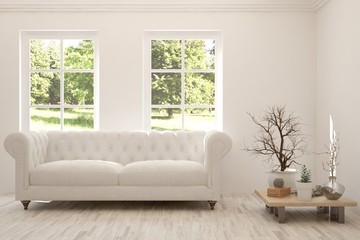 Stylish room in white color with sofa and summer landscape in window. Scandinavian interior design. 3D illustration