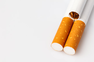 Tobacco smoking. Cigarette close up, on white background.  Bad habit. Nicotine. Drug addiction. Cancer.