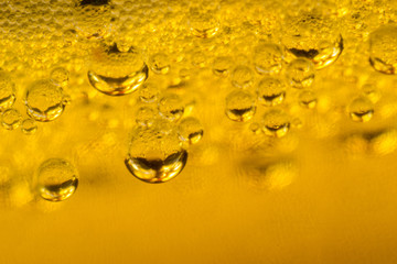 air bubbles in golden liquid abstract