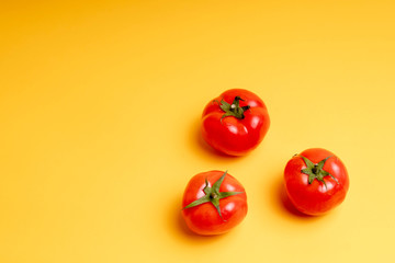 red tomatoes on a yellow background