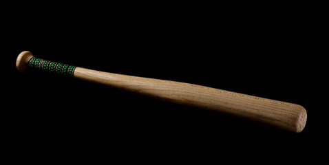Wooden baseball bat isolated on black background