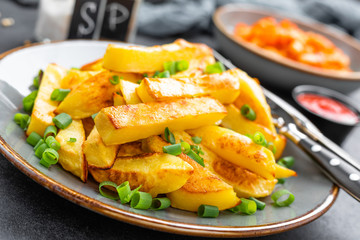 Baked, fried potato on plate