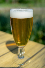 Cold Belgian white beer served outside in sunny day